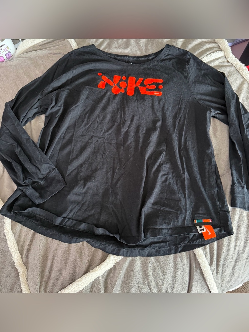 Black and orange Nike top